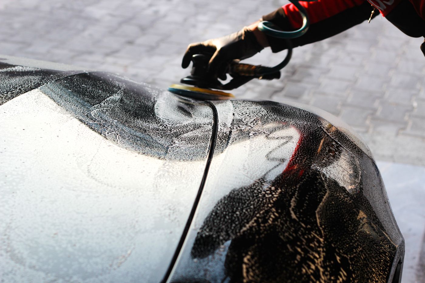 Car paintwork machine-polished to a deep, glossy finish